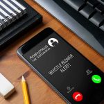 AI Fake Claim Fuels $100K Text Controversy smartphone on desk showing an incoming anonymous call