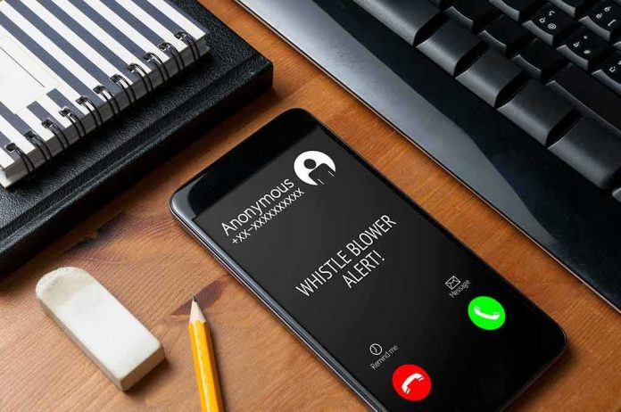 shutterstock_1588506334 smartphone on desk showing an incoming anonymous call