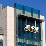 422-Megawatt Project Sparks Local Backlash in India amazon logo on modern glass office building