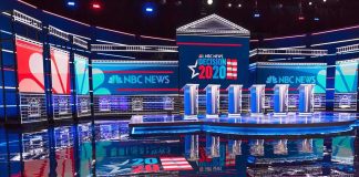 California Rivals Clash Over Cost of Living Televised debate stage with multiple podiums and bright red, white, and blue lighting