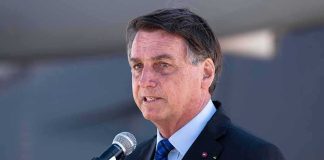 Brazil Election Draws U.S. Attention man in suit speaking at a microphone