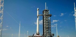 Rocket on launch pad under clear blue sky