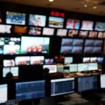 IRS Failed to Detect Suspicious Tax File Searches control room with multiple screens and monitors