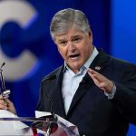 Fox News Interview Fuels White House Controversy Sean Hannity speaking at a podium