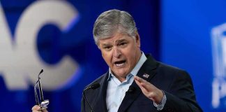 Sean Hannity speaking at a podium