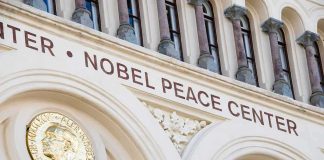 Nobel Peace Center facade with arched windows and gold medallion