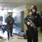Teacher and Parent Stop Oregon School Shooter Police officers responding to a school emergency with students on the floor