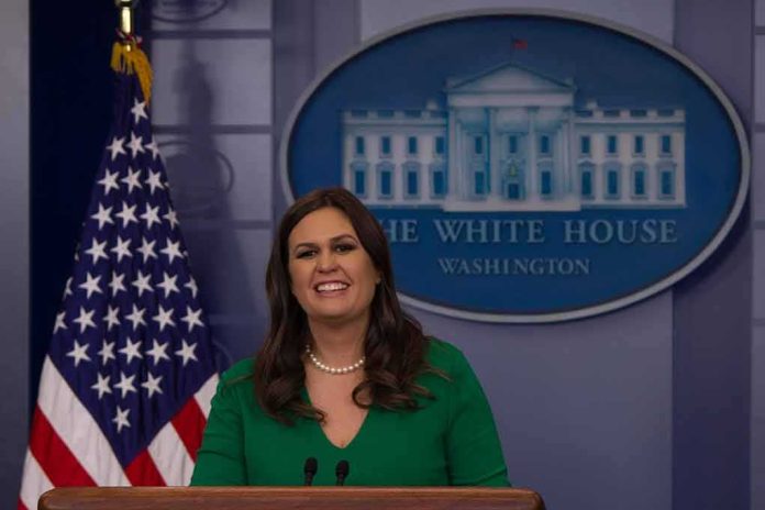 shutterstock_744405145 woman speaking at a White House press briefing podium